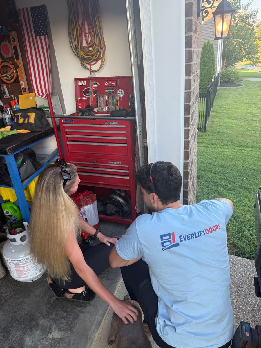 EverLift Doors technician walking a Kentucky homeowner through a garage door repair at her home
